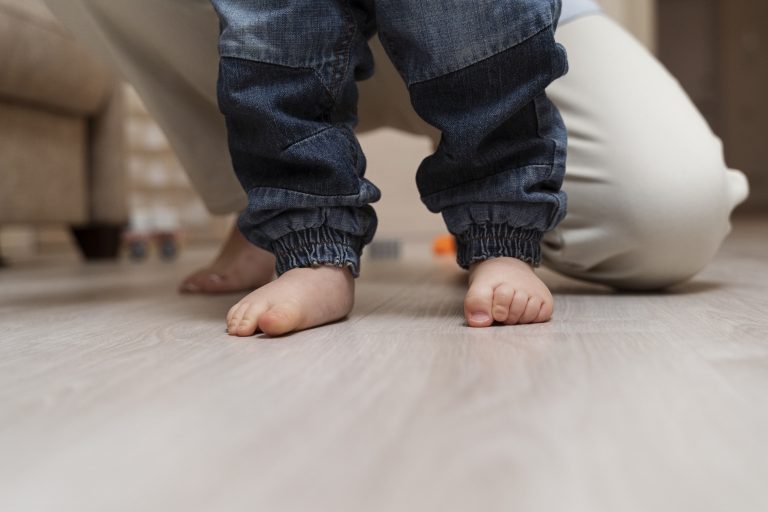 front-view-parent-cute-kid-s-feet