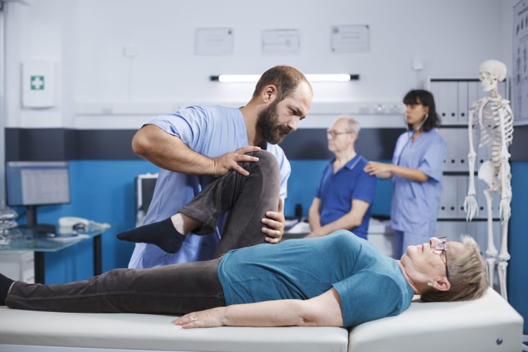 Woman doing leg exercises in hospital