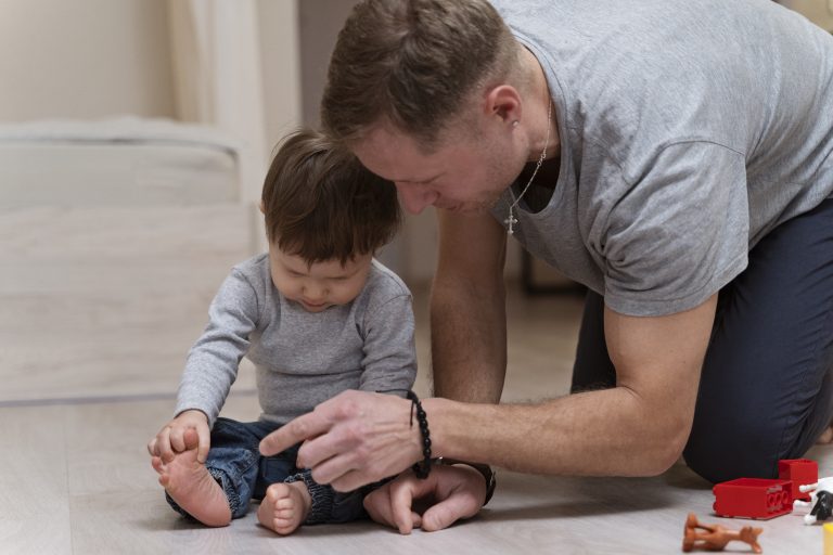 medium-shot-father-kid-with-toys